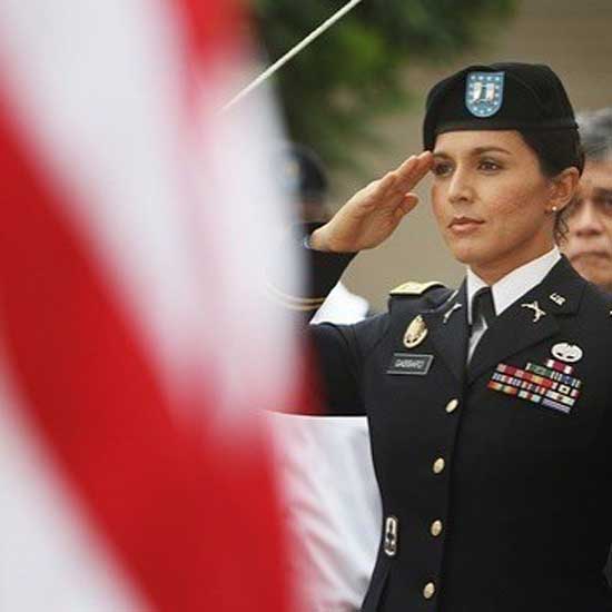 Tulsi Gabbard saluting at Hawaii Army National Guard