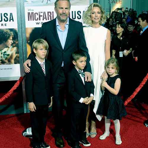Kevin Costner and Christine Baumgartner with their children