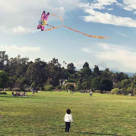 Lola Burr admiring a kite