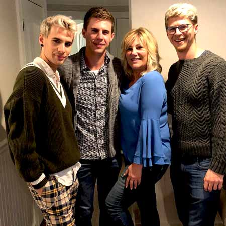 Eric Mondo with his mother and brothers